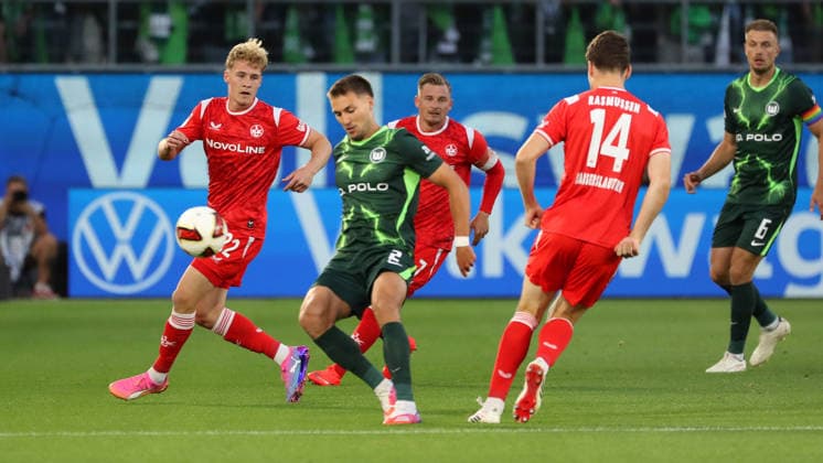 VfL vs. 1 FCK, 2. Bundesliga Wolfsburg, August 8, 2026, Soccer, Men s, 2. Bundesliga, 2026–2027 Season, VfL Wolfsburg vs. 1. FC Kaiserslautern, Mika Haas (1. FC Kaiserslautern), Kilian Fischer (VfL Wolfsburg). DFL and DFB regulations prohibit any use of photographs as image sequences and or quasi-video. Volkswagen Arena, Lower Saxony, Germany