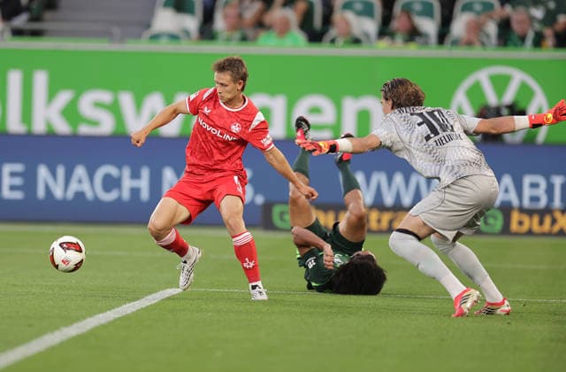 Mathys Angely, VfL Wolfsburg; Naatan Skyttae, 1. FC Kaiserslautern; Jakub Zielinski, VfL Wolfsburg; Soccer, Men s, 2026–2027 Season, 2. Bundesliga, Volkswagen Arena, VfL Wolfsburg vs. 1. FC Kaiserslautern. DFL regulations prohibit any use of photographs as image sequences and or quasi-video.