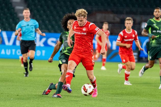 German Soccer 2. Bundesliga, Matchday 1, 2026–2027, VfL Wolfsburg vs. 1. FC Kaiserslautern on August 8, 2026, at the Volkswagen Arena in Wolfsburg: Mika Haas of 1. FC Kaiserslautern, 22, and Mathys Angely of VfL Wolfsburg, 22, in a tackle at the Volkswagen Arena in Wolfsburg, Germany Copyright: xSvenxHeidmannx