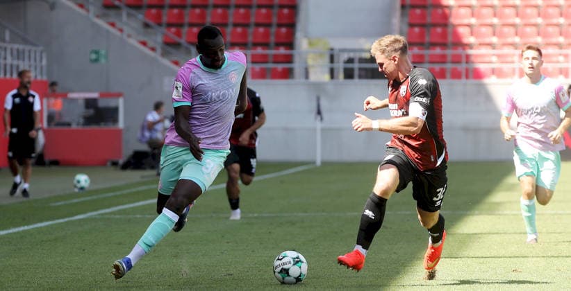 August 7, 2026, 3rd Division, FC Ingolstadt 04 vs. FC Würzburger Kickers; from left: Tarsis Bonga (FC Würzburger Kickers), Simon Lorenz (FC Ingolstadt 04); Ingolstadt, Audi Sportpark, Bavaria, Germany