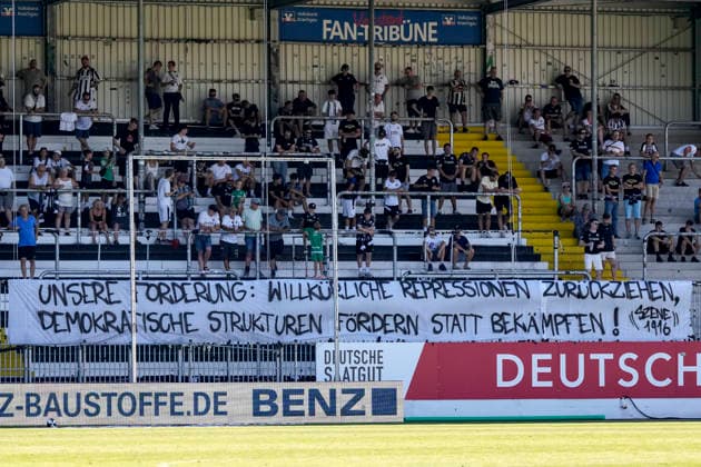 SV Sandhausen fans have stopped cheering and are displaying a banner in the fan section that reads: Our Demand: Withdraw Arbitrary Repression; Promote Democratic Structures Instead of Opposing Them, fans, ultras, crowd, spectators, mood, atmosphere, stadium, protest, protest action, protesting, action, 08 08 2026, Sandhausen, Germany, soccer, Regionalliga Südwest, SV Sandhausen vs. TSV Steinbach Haiger xozx