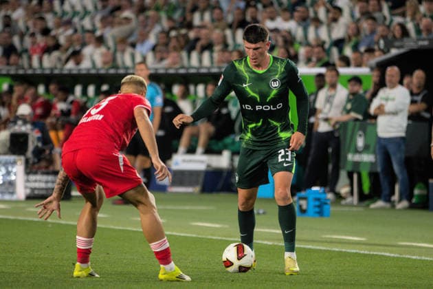 August 8, 2026 Men s Soccer 2026–2027 2. Bundesliga Matchday 1 VfL Wolfsburg vs. FC Kaiserslautern Volkswagen Arena, Wolfsburg Alessio Besio (Wolfsburg), 23, in green with the ball; Erik Wekesser of Kaiserslautern, 13, in red, watches the play; Wolfsburg, Lower Saxony, Germany