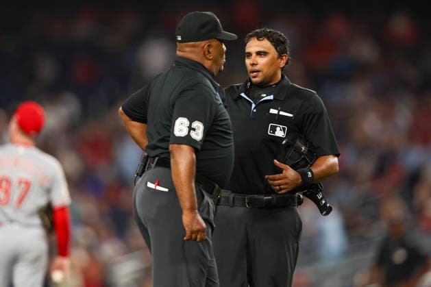 August 8, 2026, Washington D.C, District Of Columbia, United States: Washington, DC; Umpires Erich Bacchus (12) and crew chief Laz Diaz (63) discuss the replay during the Major League Baseball game between the Washington Nationals and the Cincinnati Reds at Nationals Park on Saturday, August 8, 2026. The Nationals beat the Reds 8-2. Washington D.C United States - ZUMAp258 20260808_znp_p258_073 Copyright: xStevexPrakopex