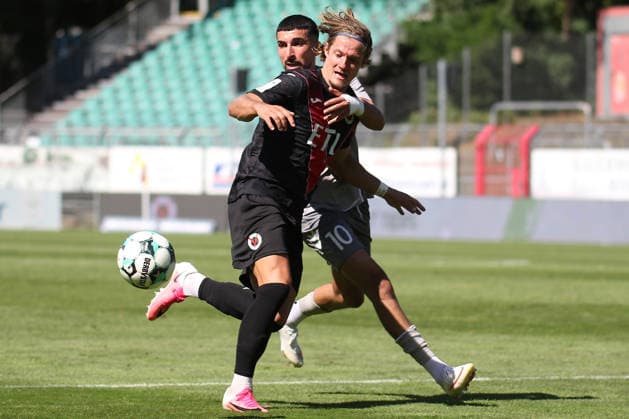 August 8, 2026, xsefx, Soccer, FC Viktoria Köln vs. SSV Jahn Regensburg, 3. Liga, Sportpark Höhenberg, Matchday 1, 2026–2027 Season: Tobias Eisenhuth of FC Viktoria Köln 06 in a tackle against Nassim Boujellab of Jahn Regensburg. 10. DFB regulations prohibit any use of photographs as image sequences and or quasi-video. North Rhine-Westphalia, Germany