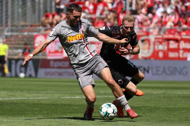 August 8, 2026, xsefx, Soccer, FC Viktoria Köln vs. SSV Jahn Regensburg, 3. Liga, Sportpark Höhenberg, Matchday 1, 2026–2027 Season: Oscar Schönfelder of Jahn Regensburg 07 in a tackle against Meiko Sponsel of FC Viktoria Köln 19. DFB regulations prohibit any use of photographs as image sequences and or quasi-video. North Rhine-Westphalia, Germany