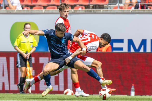 Regionalliga Northeast, Season 26–27: Hallescher FC vs. Chemnitzer FC, Halle, Germany, August 9, 2026. Pictured, from left, in a tackle: Maurizio Grimaldi (Chemnitz) and Stanley Ratifo (Halle). Halle-Saale, Leuna, Chemie Stadium, Saxony-Anhalt, Germany