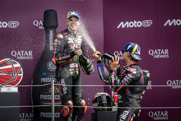 RECORD DATE NOT STATED 9th August 2026; Silverstone Circuit, Northamptonshire, England; 2026 MotoGP Grand Prix of Great Britain, Race Day; Raul Fernandez of the Superfile Trackhouse Team celebrates on the podium after winning the Qatar Airways British Grand Prix MotoGP and sprays Prosecco at Marco Bezzecchi of the Aprilia Racing Team GodfreyxPitt