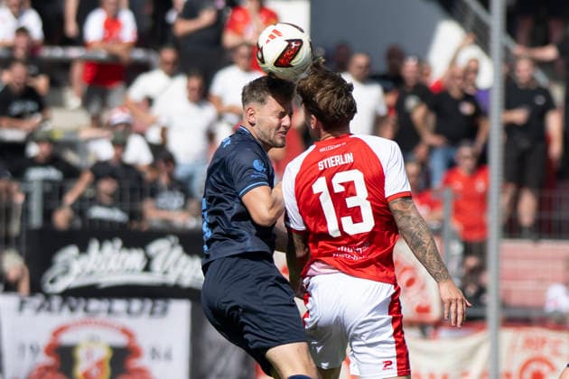 Regionalliga Northeast, Season 26–27: Hallescher FC vs. Chemnitzer FC, Halle, Germany, August 9, 2026. Pictured, from left, in a tackle: Justin Gröger (Groeger) of Chemnitz and Niclas Stierlin of Halle; header, header duel; Halle Saale Leuna Chemie Stadium, Saxony-Anhalt, Germany