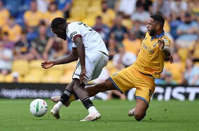 Femi Seriki of Sheffield United is tackled by Tyler Roberts of Mansfield Town Mansfield Town v Sheffield United, EFL Carabao Cup, First Round, Football, One Call Stadium, Mansfield, UK - 09 Aug 2026Mansfield One Call Stadium United Kingdom EDITORIAL USE ONLY No use with unauthorised audio, video, data, fixture lists, club league logos or live services. Online in-match use limited to 120 images, no video emulation. No use in betting, games or single club league player publications. Copyright: xAnnaxGowthorpe Shutterstockx 17051191ag