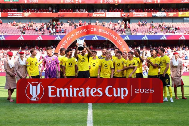 Felix Nmecha of Borussia Dortmund lifts the Emirates Cup after defeating Arsenal 3–2 during the preseason friendly match between Arsenal FC and Borussia Dortmund at Emirates Stadium on August 9, 2026, in London, England. Photo by Ryan Crockett, DeFodi Images