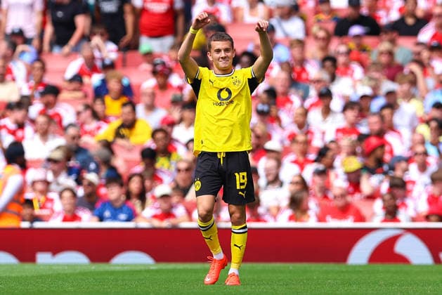 Konstantinos Karetsas of Borussia Dortmund celebrates his goal—his team s second—during the preseason friendly match between Arsenal FC and Borussia Dortmund at Emirates Stadium on August 9, 2026, in London, England. Photo by Ryan Crockett, DeFodi Images