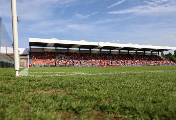 Soccer, Women s, 2026–2027 Season, FC Bayern Munich vs. Paris FC, Friendly Match, Exhibition Match, Sportpark Unterhaching Here s a view of the field and the opposite stands with spectators and fans at Sportpark Unterhaching