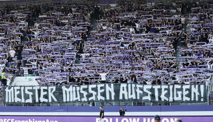 Aue, August 6, 2026, Erzgebirgsstadion, Soccer, Regionalliga, Matchday 1: FC Erzgebirge Aue vs. Berliner FC Dynamo, Pictured: Protest against the stalled efforts toward Regional League reform; Erzgebirge Aue fans display a banner, For editorial use only, DFB and NOFV regulations prohibit any use of photographs as image sequences and or quasi-video, Picture Point