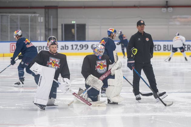 Goalies Antonie Bibeau, 30, of EHC Red Bull Munich, and Mathias Niederberger, 35, of EHC Red Bull Munich, are waiting to take the ice, alongside assistant coach Dimitri Paetzold, EHC Red Bull Munich press practice, August 10, 2026, Munich, Bavaria, Germany Copyright: xkolbert-press UlrichxGamelx