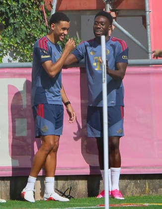 August 10, 2026, FC Bayern Training, Saebenerstrasse, Munich, Soccer, Sports; Pictured: Jamal Musiala of FC Bayern Munich and Alphons Davies of FC Bayern Munich back at team training in high spirits