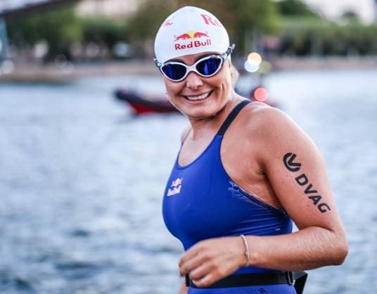 Extreme swimmer Nathalie Pohl kicks off her 200-km river challenge at Holbeinsteg in Frankfurt on August 26, 2011. Extreme swimmer Nathalie Pohl at the start of her charity challenge, RIVERS Frankfurt to Cologne, at Holbeinsteg on the Main River. In four days, she will swim over 200 kilometers from Frankfurt to Cologne to raise funds for children’s swimming programs in partnership with DVAG hilft e.V. and the RTL Charity Marathon, and to raise awareness about the importance of water safety. Frankfurt, Holbeinsteg, Hesse, Germany IKW_4816