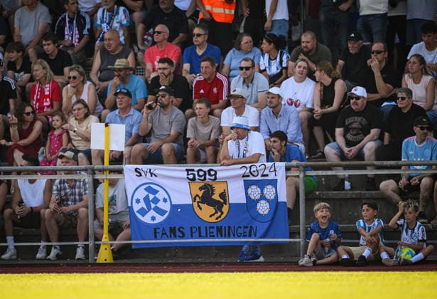 Soccer WFV Cup 2026–2027, Round 3, August 11, 2026: FC Rottenburg vs. SV Stuttgarter Kickers. SV Stuttgarter Kickers fans with a banner; Plieningen fans at Rottenburg’s Hohenberg Stadium