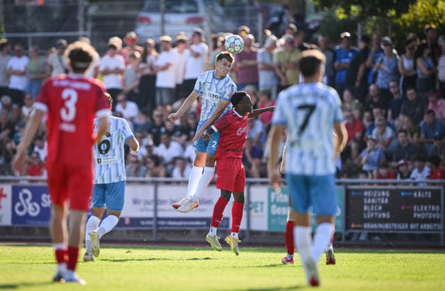 Soccer WFV Cup 2026–2027, Round 3, August 11, 2026: FC Rottenburg vs. SV Stuttgarter Kickers—Vincent Schwab (left, Kickers) vs. Ruben Nyanga (right, FC Rottenburg)