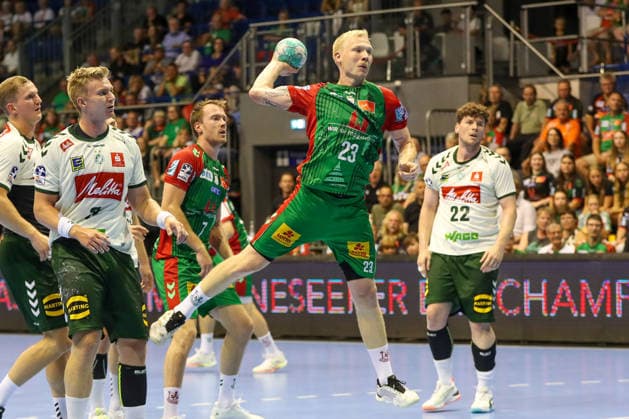 August 11, 2026, xgox, Handball Hummel Cup 2026 SC Magdeburg vs. GWD Mindenemspor, from left: Magnus Saugstrup (Magdeburg), 23 shots on goal, goal scorer, scores a goal, Magdeburg