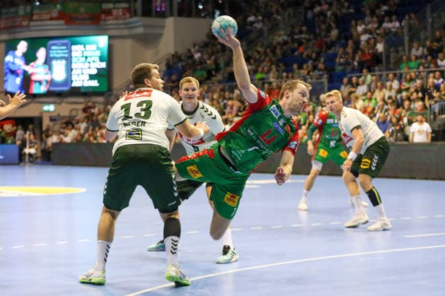 August 11, 2026, xgox, 2026 Hummel Cup Handball Match: SC Magdeburg vs. GWD Mindenemspor, from left: Felix Claar (Magdeburg), 7 takes a shot, goal scorer, scores a goal, Magdeburg