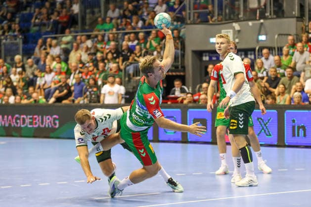 August 11, 2026, xgox, 2026 Hummel Cup Handball Match: SC Magdeburg vs. GWD Mindenemspor, from left: Albin Lagergren (Magdeburg), 21 shots on goal, goal scorer, scores a goal, Magdeburg