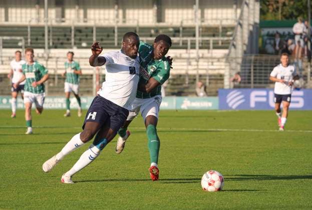 Photo: Anouar ADAM (Oldenburg) vs. Emmanuel APPIAH (Lübeck), right—Regionalliga Nord soccer match, Tue, Aug 11, 2026, VfB Lübeck vs. VfB Oldenburg