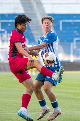 August 11, 2026 Men s Soccer 2026–2027 Northeast Regional League, Matchday 4: 1 FC Magdeburg II vs. SV Babelsberg 03, Avnet Arena, Magdeburg; Min Gi Kang (Babelsberg), 21, in red, in a tackle with Adrian Drews of Magdeburg, 36, in blue and white Magdeburg Saxony-Anhalt Germany
