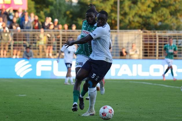 August 26, 2026, GER, Regionalliga Nord, Soccer, Matchday 1, 2026–2027 Season, Dietmar Scholze Stadium an der Lohmuehle, VfB Lübeck vs. VfB Oldenburg: Daouda Beleme (VfB Lübeck 21) in a tackle against Anouar Adam (VfB Oldenburg 05). Photo: nordphoto GmbH, Tauchnitz, Lübeck, Dietmar Scholze Stadium an der Lohmuehle, SH, Germany Copyright: xnordphotoxGmbHx xTauchnitzx