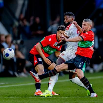 NIJMEGEN: Olympiacos Piraeus defender Rodinei and NEC Nijmegen forward Bryan Linssen during the Champions League match between NEC and Olympiacos at De Goffert Stadium on August 11, 2026, in Nijmegen, the Netherlands