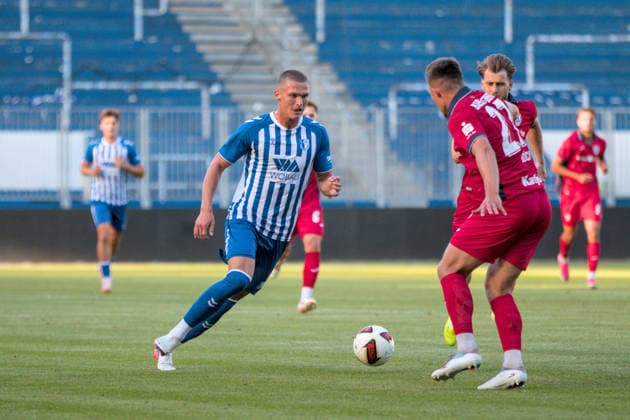August 11, 2026 Men s Soccer 2026–2027 Northeast Regional League, Matchday 4: 1 FC Magdeburg II vs. SV Babelsberg 03, Avnet Arena, Magdeburg, Kevin Manthey, Magdeburg, 37, in blue and white, tries to pass the ball past Gordon Büch of Babelsberg, 27, in red Magdeburg, Saxony-Anhalt, Germany