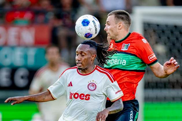 NIJMEGEN: Olympiacos Piraeus forward Gelson Martins and NEC Nijmegen midfielder Darko Nejasmic during the Champions League match between NEC and Olympiacos at De Goffert Stadium on August 11, 2026, in Nijmegen, the Netherlands