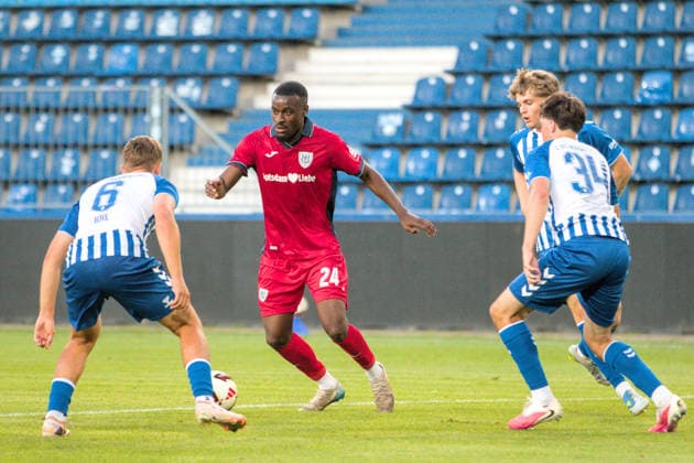 August 11, 2026 Men s Soccer 2026–2027 Northeast Regional League, Matchday 4: 1 FC Magdeburg II vs. SV Babelsberg 03, Avnet Arena, Magdeburg; Charles Jesaja Herrmann (Babelsberg), 24, in red, surrounded by Timo Birk, Magdeburg, 6, in blue and white; Leander Beimborn, Magdeburg, 34, in blue and white; and Steven Probst, Magdeburg, 23, in blue and white; Magdeburg, Saxony-Anhalt, Germany