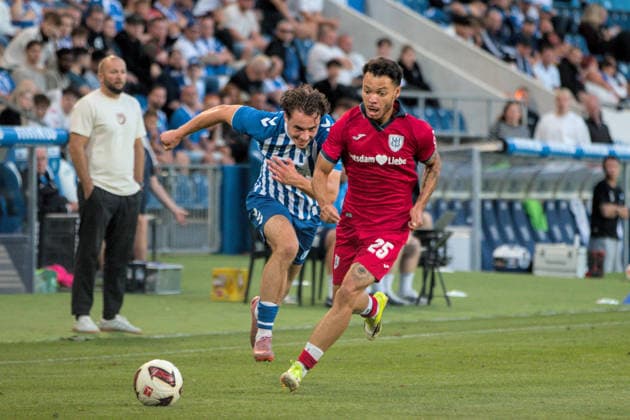 August 11, 2026 Men s Soccer 2026–2027 Northeast Regional League, Matchday 4: 1. FC Magdeburg II vs. SV Babelsberg 03, Avnet Arena, Magdeburg; Theo Ogbidi (Babelsberg), 25, in red, in a footrace with Marcel Zajusch of Magdeburg, 28, in blue and white; Magdeburg, Saxony-Anhalt, Germany