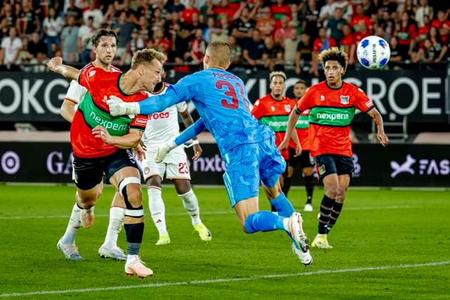 NIJMEGEN N E C Nijmegen forward Kaj Sierhuis scores the 2-1 goal, but it is ruled offside during the Champions League match between N E C and Olympiacos at Stadion de Goffert on August 11, 2026, in Nijmegen, the Netherlands