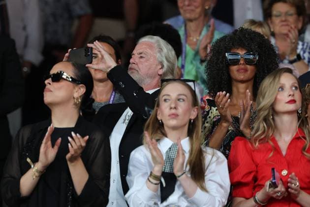 Hermann Bühlbecker, Managing Director of Aachener Printen und Schokoladenfabrik Henry Lambertz GmbH Co KG, filming with his cell phone while accompanied by others in the stands, Opening Ceremony, AACHEN FEI World Championships 2026, World Festival of Equestrian Sports, 2026 Equestrian World Championships, Aachen 2026, Welcome Home 2026, Aachen Soers, August 11–23, 2026, Equestrian Sports, August 11, 2026, Aachen Soers, Germany