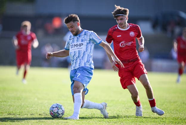 Soccer WFV Cup 2026–2027, Round 3, August 11, 2026: FC Rottenburg vs. SV Stuttgarter Kickers—Yannick Glessing (left, Kickers) vs. Raphael Langer (right, FC Rottenburg)