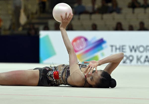 August 12, 2026, xhbx, 2026 Rhythmic Gymnastics World Championships, from left: Qi Wang, China; DFL; DFB. REGULATIONS PROHIBIT ANY USE OF PHOTOGRAPHS AS IMAGE SEQUENCES AND OR QUASI-VIDEO. Frankfurt am Main