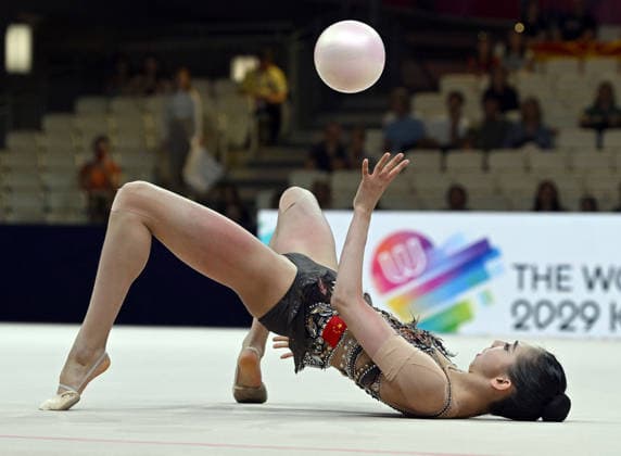 August 12, 2026, xhbx, 2026 Rhythmic Gymnastics World Championships, from left: Qi Wang, China; DFL; DFB. REGULATIONS PROHIBIT ANY USE OF PHOTOGRAPHS AS IMAGE SEQUENCES AND OR QUASI-VIDEO. Frankfurt am Main