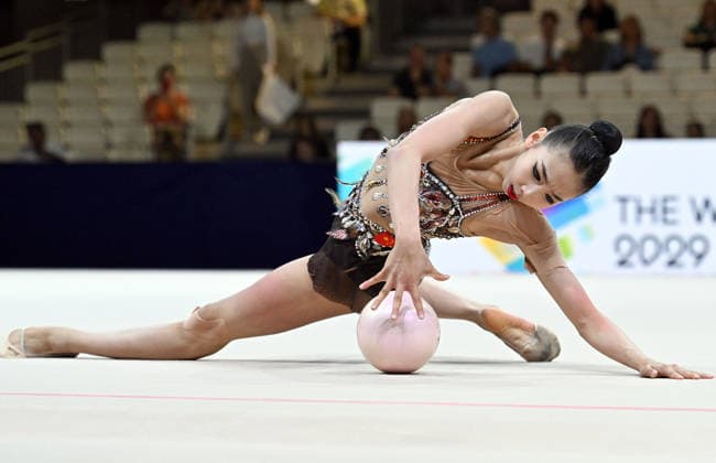 August 12, 2026, xhbx, 2026 Rhythmic Gymnastics World Championships, from left: Qi Wang, China; DFL; DFB. REGULATIONS PROHIBIT ANY USE OF PHOTOGRAPHS AS IMAGE SEQUENCES AND OR QUASI-VIDEO. Frankfurt am Main