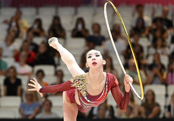 August 12, 2026, xhbx, 2026 Rhythmic Gymnastics World Championships, from left: Qi Wang (China), hoop routine. DFL and DFB regulations prohibit any use of photographs as image sequences and or quasi-video. Frankfurt am Main