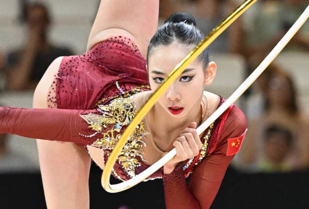 August 12, 2026, xhbx, 2026 Rhythmic Gymnastics World Championships, from left: Qi Wang (China), hoop routine. DFL and DFB regulations prohibit any use of photographs as image sequences and or quasi-video. Frankfurt am Main