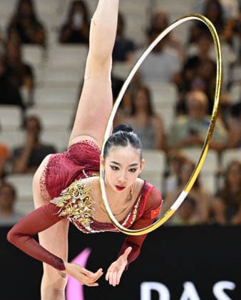 August 12, 2026, xhbx, 2026 Rhythmic Gymnastics World Championships, from left: Qi Wang (China), hoop routine. DFL and DFB regulations prohibit any use of photographs as image sequences and or quasi-video. Frankfurt am Main