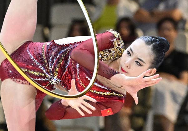 August 12, 2026, xhbx, 2026 Rhythmic Gymnastics World Championships, from left: Qi Wang (China), hoop routine. DFL and DFB regulations prohibit any use of photographs as image sequences and or quasi-video. Frankfurt am Main