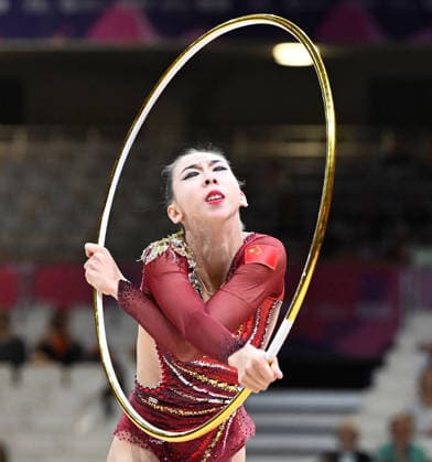 August 12, 2026, xhbx, 2026 Rhythmic Gymnastics World Championships, from left: Qi Wang (China), hoop routine. DFL and DFB regulations prohibit any use of photographs as image sequences and or quasi-video. Frankfurt am Main