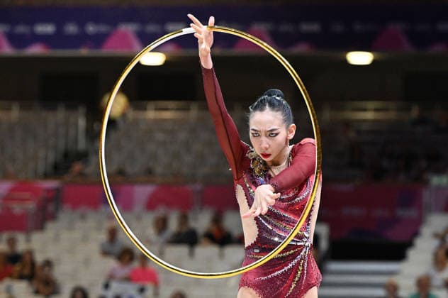 August 12, 2026, xhbx, 2026 Rhythmic Gymnastics World Championships, from left: Qi Wang (China), hoop routine. DFL and DFB regulations prohibit any use of photographs as image sequences and or quasi-video. Frankfurt am Main