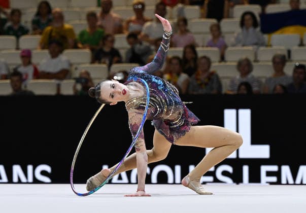 August 12, 2026, xhbx, 2026 Rhythmic Gymnastics World Championships, from left: Takhmina Ikromova, Uzbekistan, hoop routine. DFL and DFB regulations prohibit any use of photographs as image sequences and or quasi-video. Frankfurt am Main
