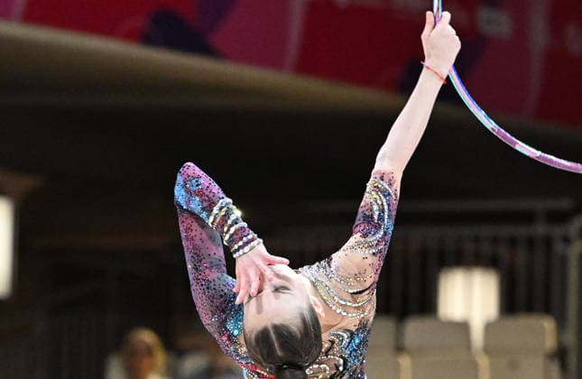 August 12, 2026, xhbx, 2026 Rhythmic Gymnastics World Championships, from left: Takhmina Ikromova, Uzbekistan, hoop routine. DFL and DFB regulations prohibit any use of photographs as image sequences and or quasi-video. Frankfurt am Main