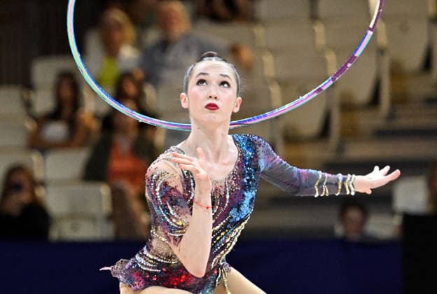 August 12, 2026, xhbx, 2026 Rhythmic Gymnastics World Championships, from left: Takhmina Ikromova, Uzbekistan, hoop routine. DFL and DFB regulations prohibit any use of photographs as image sequences and or quasi-video. Frankfurt am Main