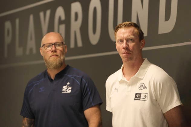 Photo: Coach Boerge LUND of THW Kiel and, on the left, Coach Ales PAJOVIC of Flensburg in conversation at the start of the Handball Bundesliga season; press conference of the northern clubs in Kiel on Tuesday, August 11, 2026