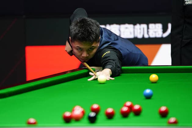 TAIYUAN, CHINA - AUGUST 12: Zhou Yuelong of China plays a shot in the second round match against Liu Hongyu of China on day 5 of the 2026 World Snooker Tour China Open at Taiyuan Binhe Sports Center on August 12, 2026 in Taiyuan, Shanxi Province of China.  Copyright: xTaixChengzhex 111659519972